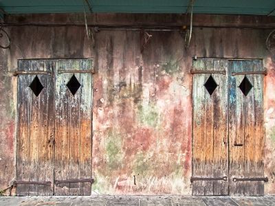 Two Old Doors on an Old Building in The French Quarter