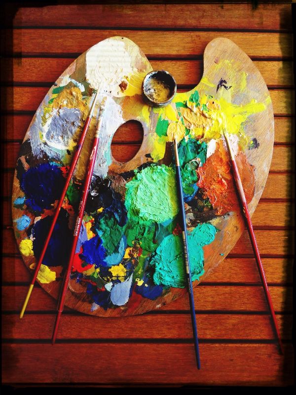 Close-Up Of Messy Palette On Table