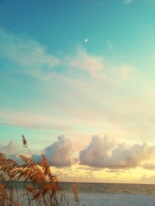 Scenic View Of Sea Against Sunset Sky With Crescent Moon