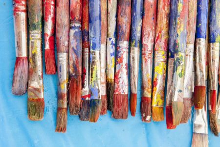 Close up of painter's messy brushes