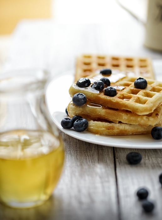 Stack of waffle  with blueberry and honey