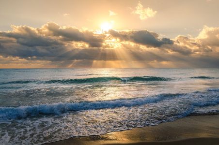 Scenic View Of Beach Against Sky During Sunset