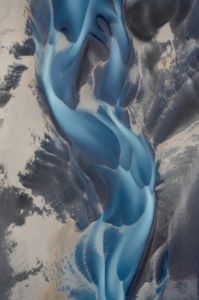 Braided river flowing across the landscape seen from directly ab