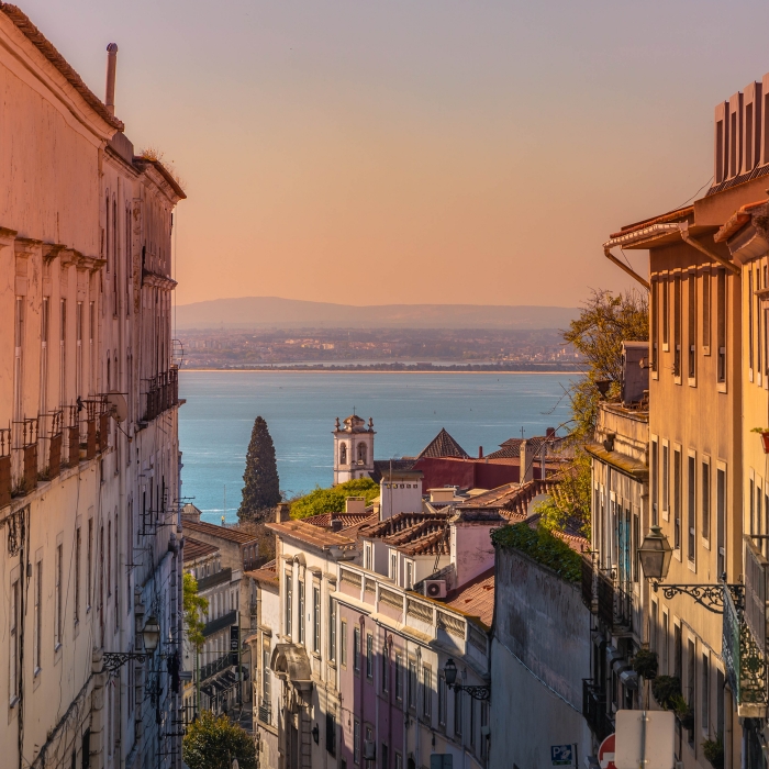 Colorful view of the Alfama district in Lisbon with church and s